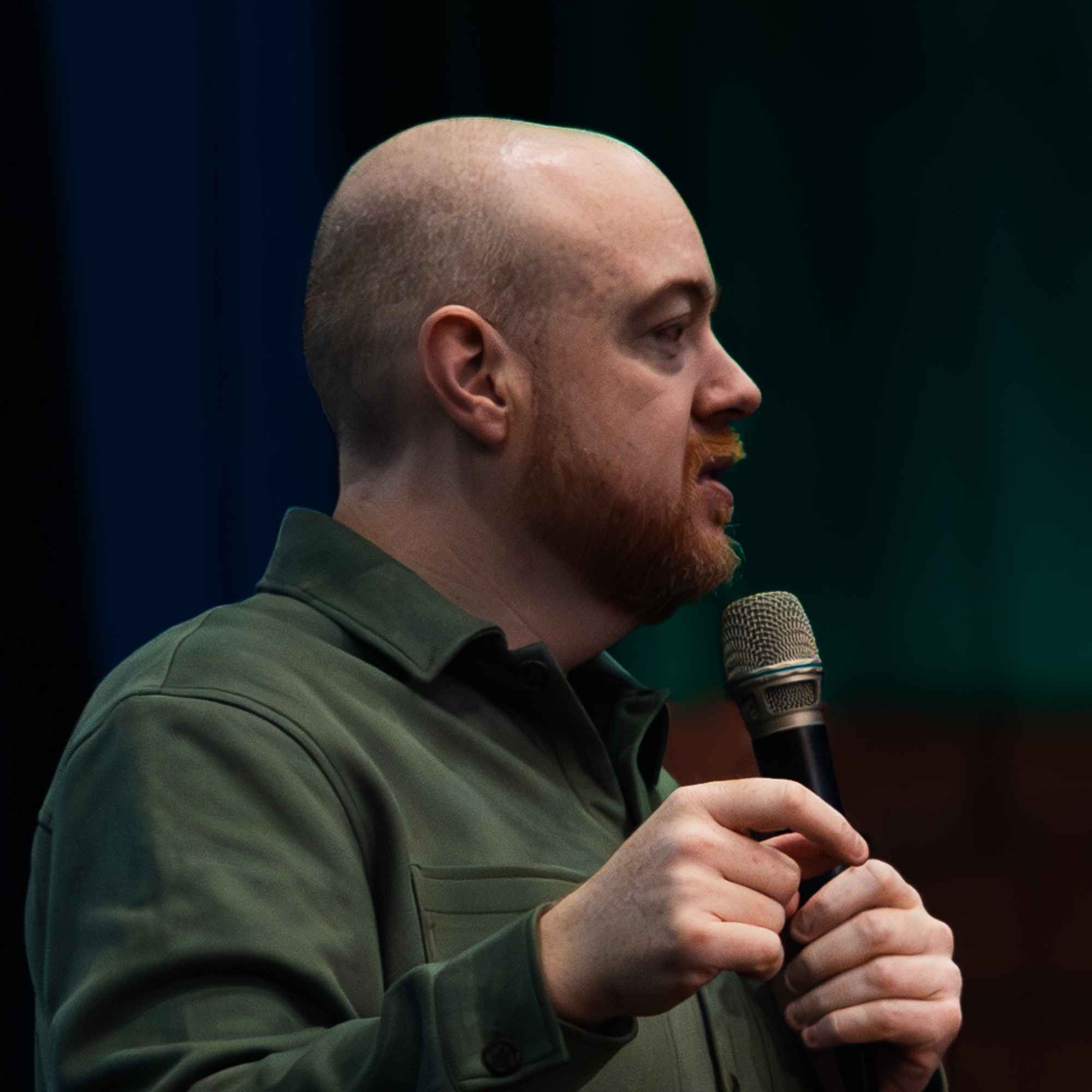 Dan Fitzpatrick speaking into a microphone