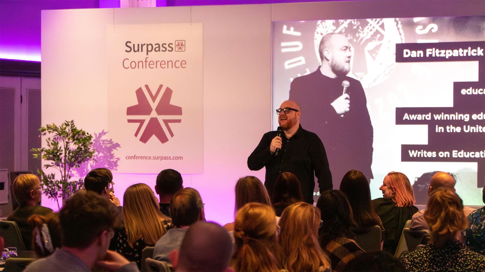 Dan Fitzpatrick speaking to an audience at the Surpass Conference